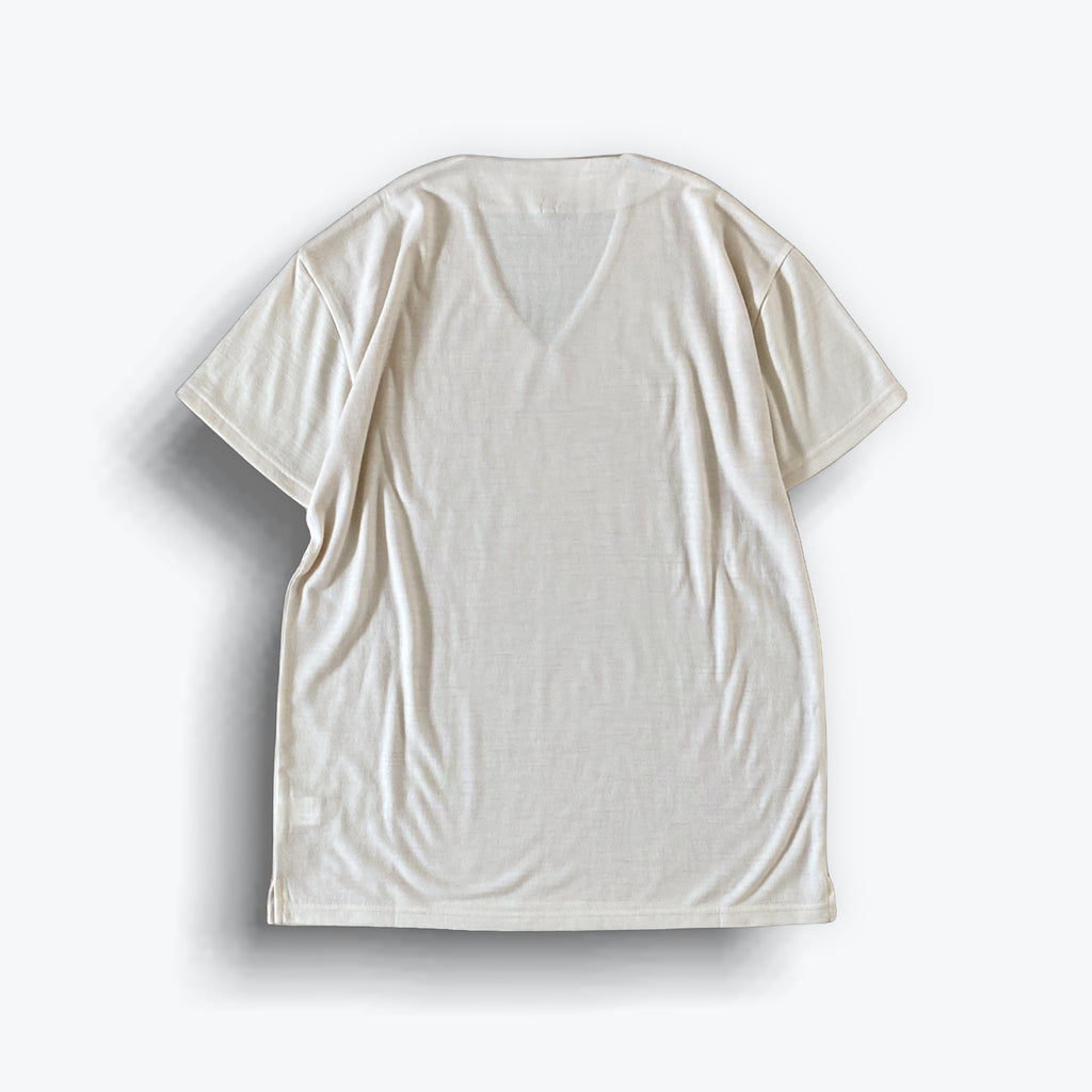 Cleaveland<br> "De partout"<br> Pull en V à manches courtes en jersey de laine beige clair