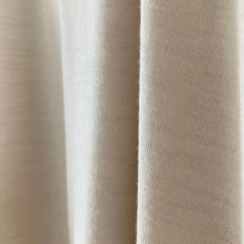 Cleaveland<br> "De partout"<br> Pull en V à manches courtes en jersey de laine beige clair